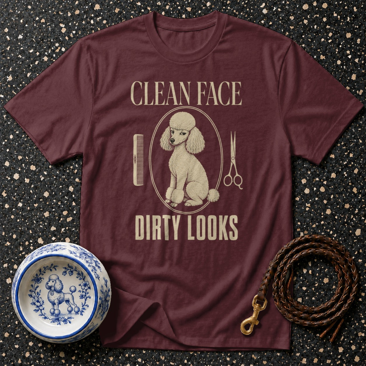 Maroon t-shirt with a poodle, comb, scissors, and text "CLEAN FACE DIRTY LOOKS".