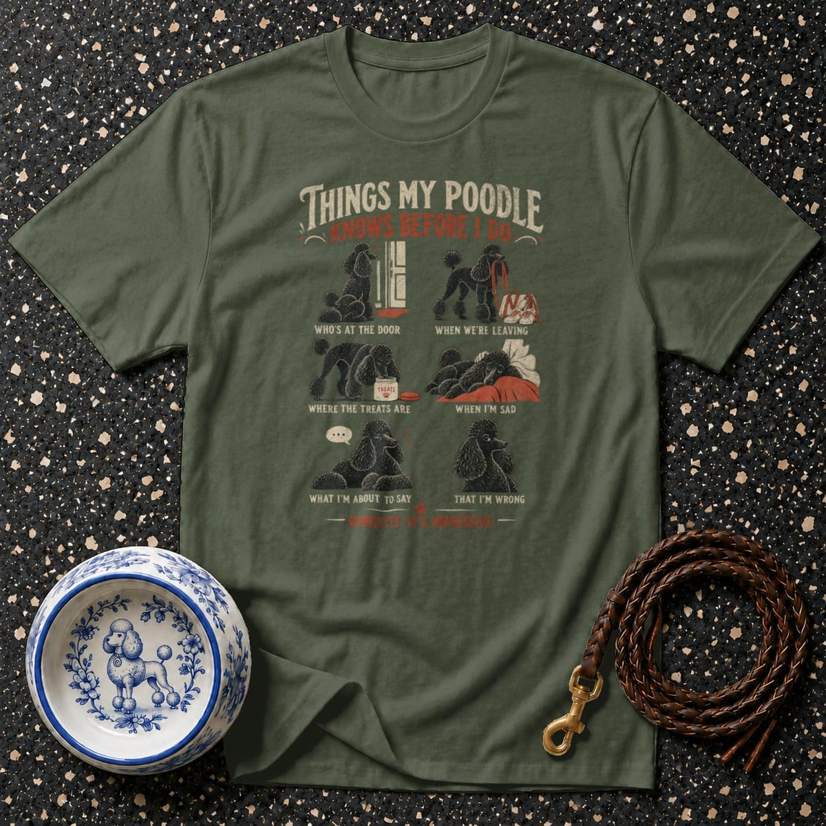 Olive green t-shirt with graphic of poodles knowing things before the owner.