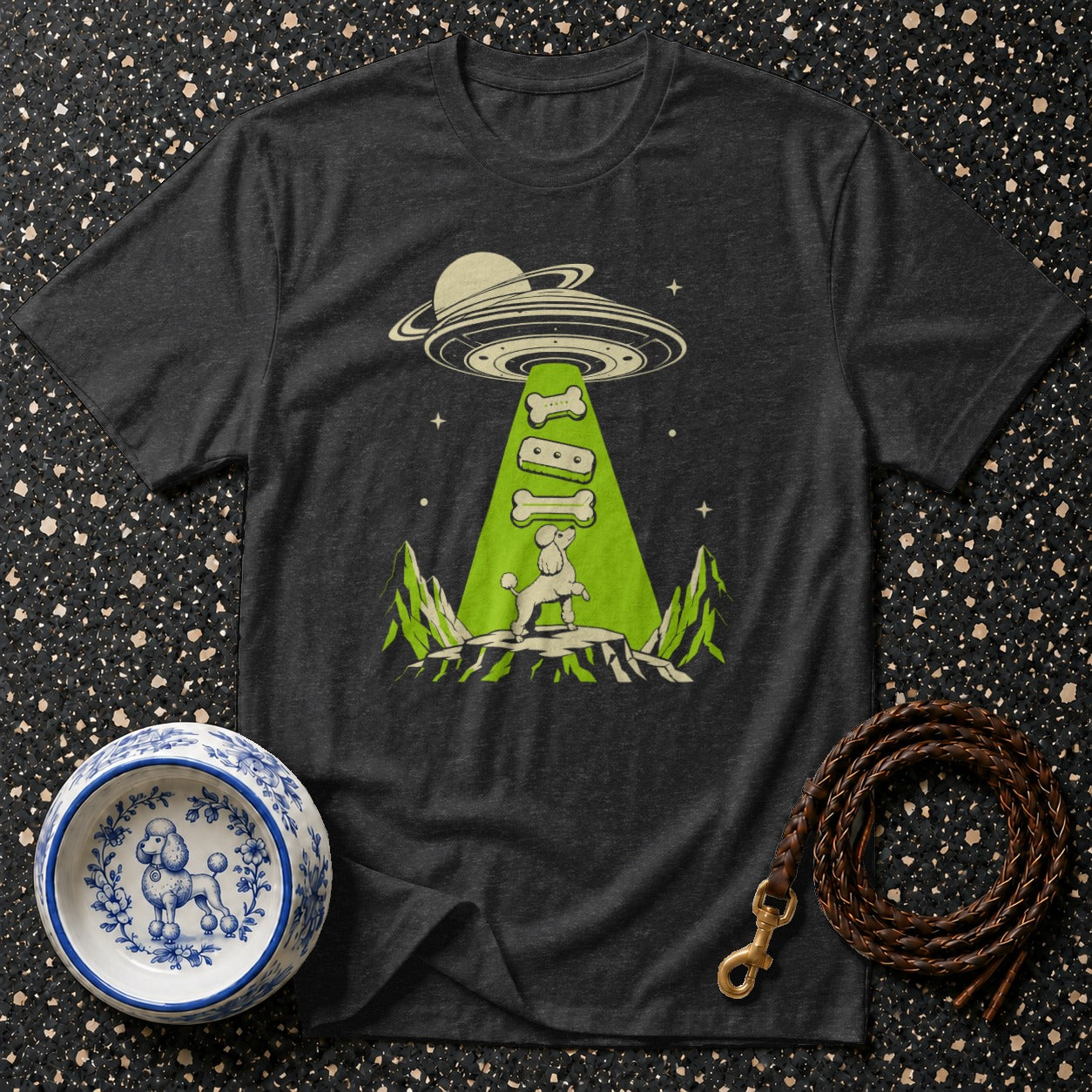 T-shirt graphic shows poodle being abducted by a UFO, beam lifts dog treats.