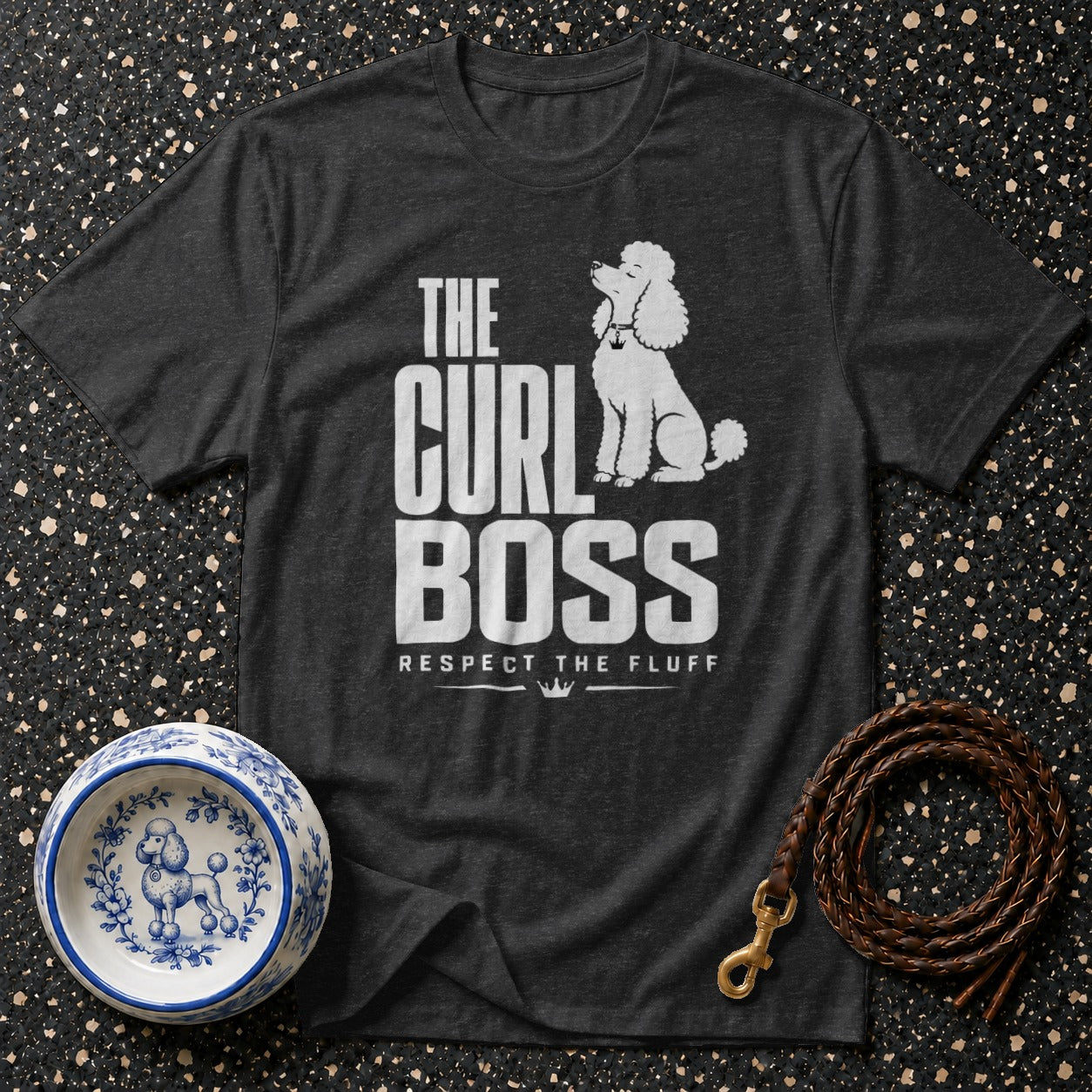 Dark grey t-shirt with white text "THE CURL BOSS RESPECT THE FLUFF" and a poodle graphic.
