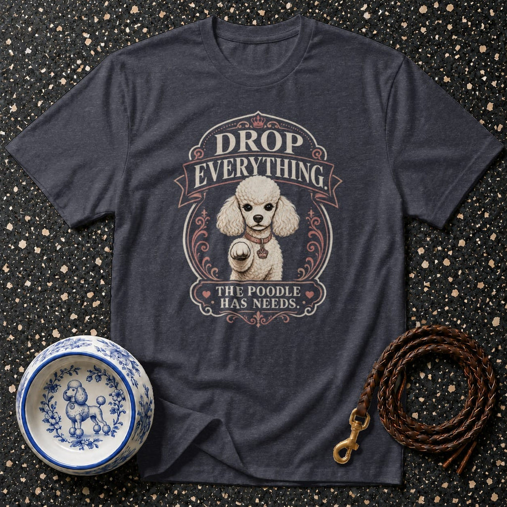 Dark t-shirt with poodle graphic and text "DROP EVERYTHING THE POODLE HAS NEEDS."