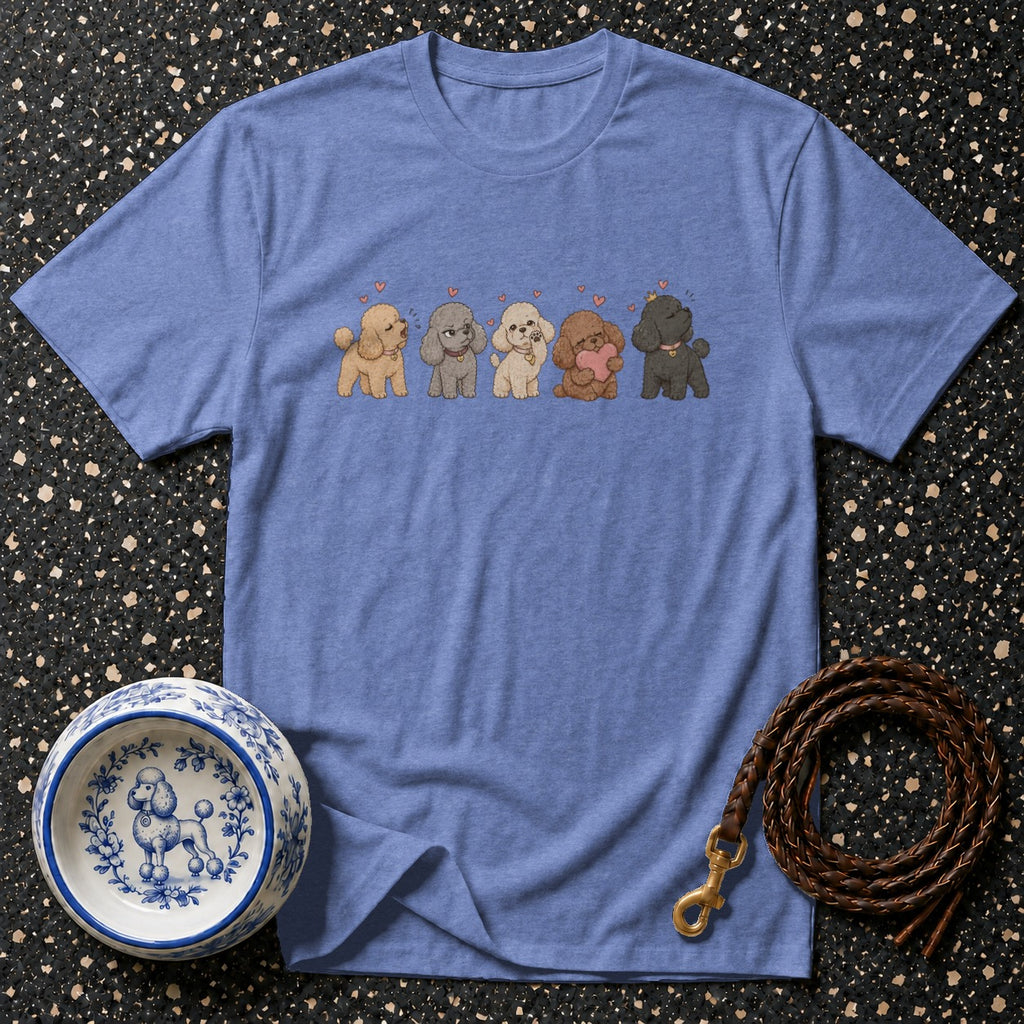 T-shirt with a graphic of five cute poodles in different colors and poses.