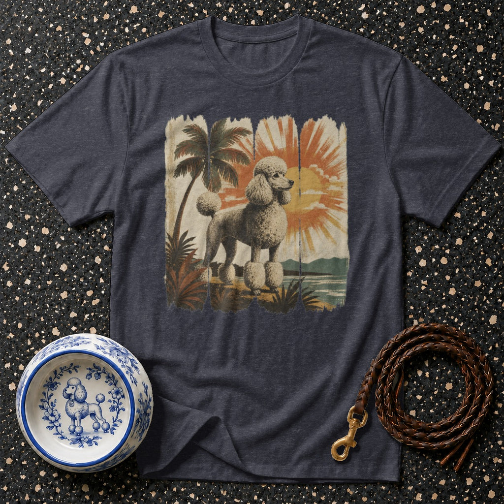 Dark t-shirt with a distressed graphic of a poodle on a tropical beach at sunset.