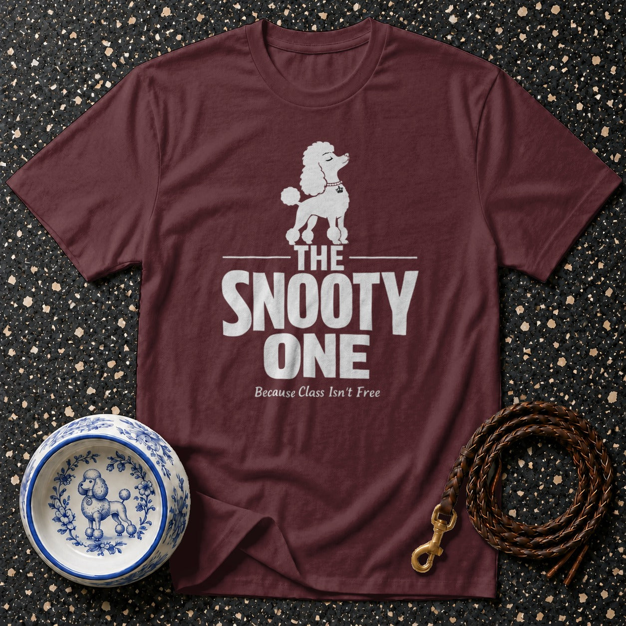 Maroon t-shirt with white poodle graphic and text "The Snooty One".