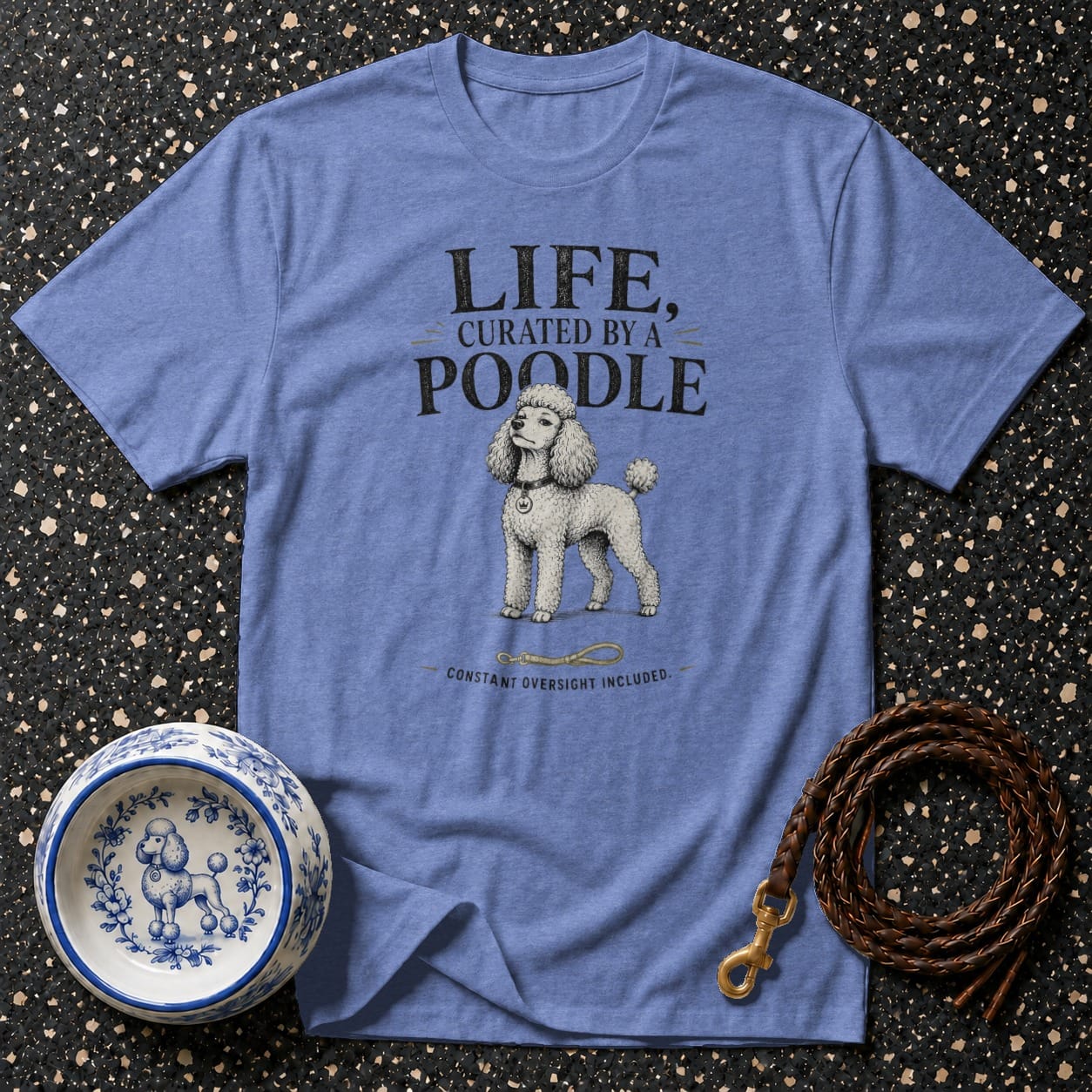 Blue t-shirt with "LIFE, CURATED BY A POODLE CONSTANT OVERSIGHT INCLUDED" text.