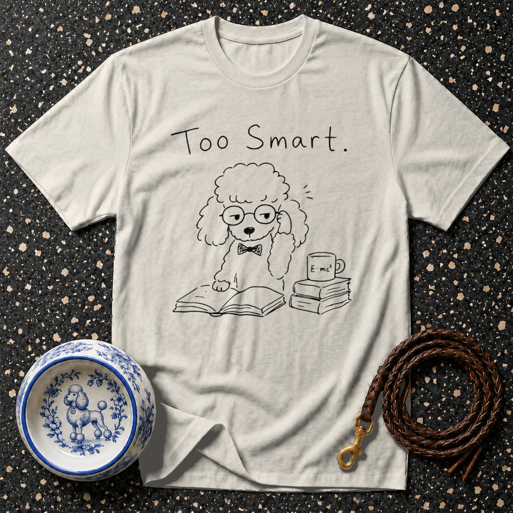 T-shirt with a poodle wearing glasses reading a book and the text "Too Smart."