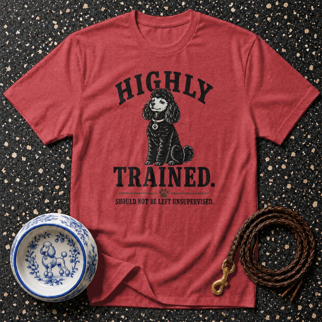 Red t-shirt with black poodle graphic and text "HIGHLY TRAINED. SHOULD NOT BE LEFT UNSUPERVISED."