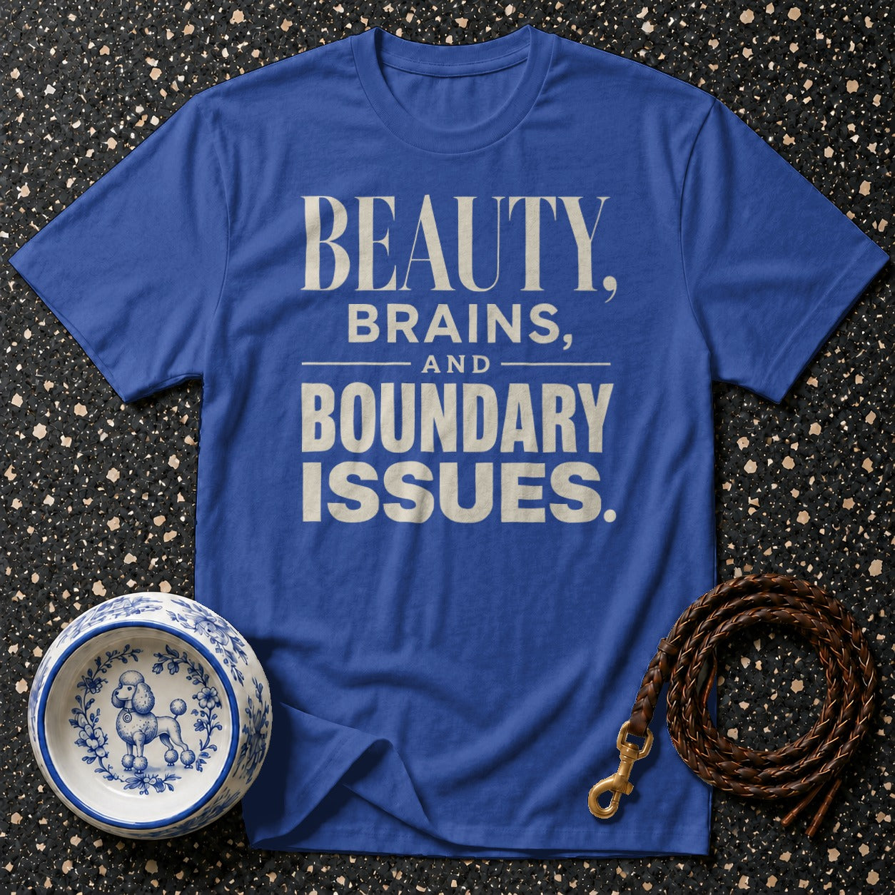 Blue t-shirt with "BEAUTY, BRAINS, AND BOUNDARY ISSUES." text, dog bowl, and leash.