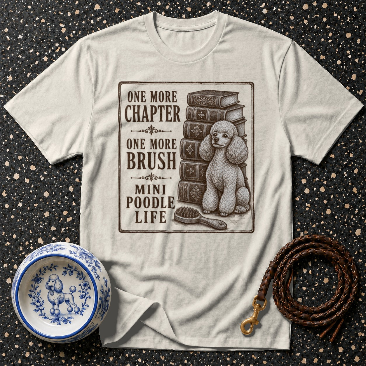 T-shirt with distressed illustration: "One More Chapter, One More Brush, Mini Poodle Life".