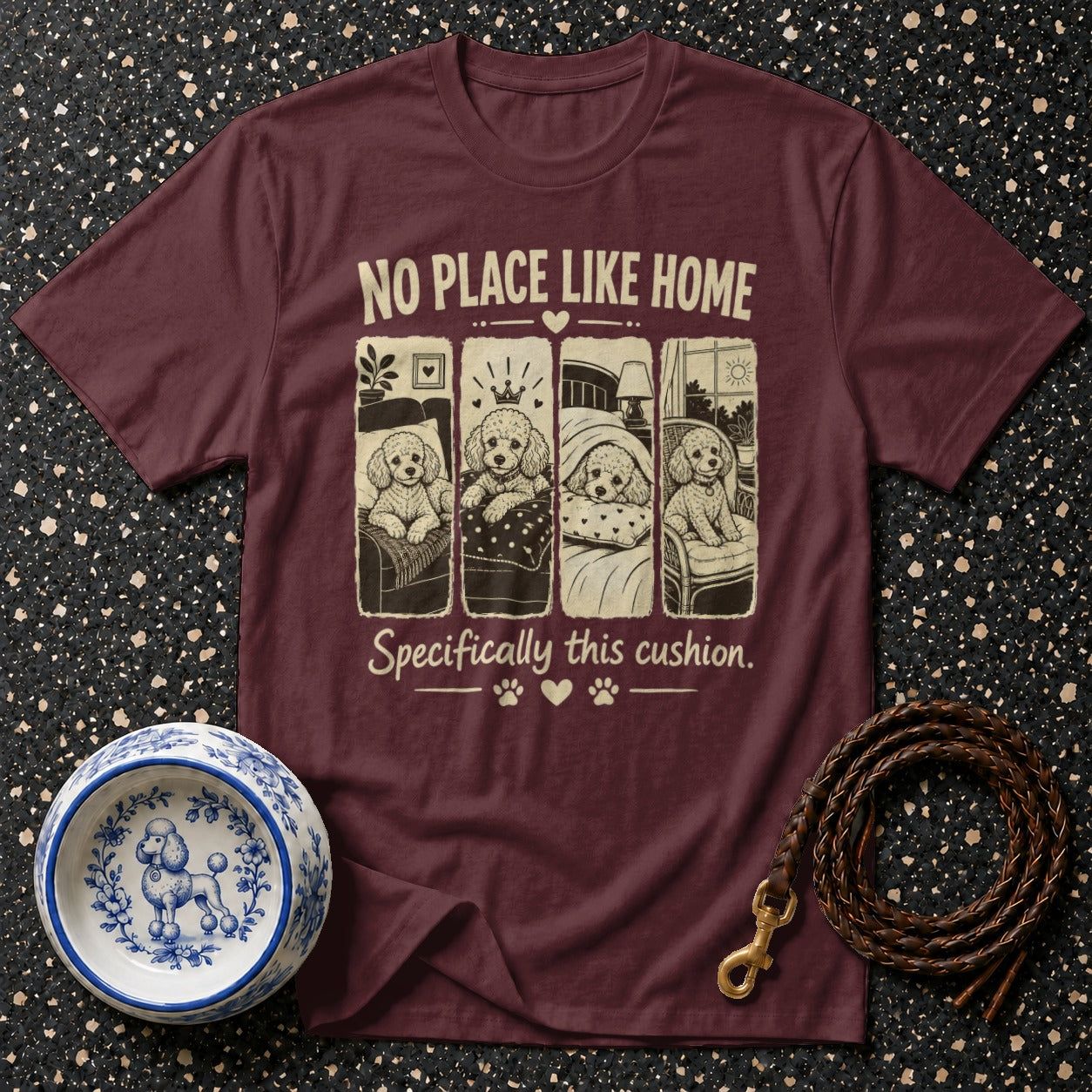 Maroon t-shirt with poodles in beds and chairs, reads "No place like home".