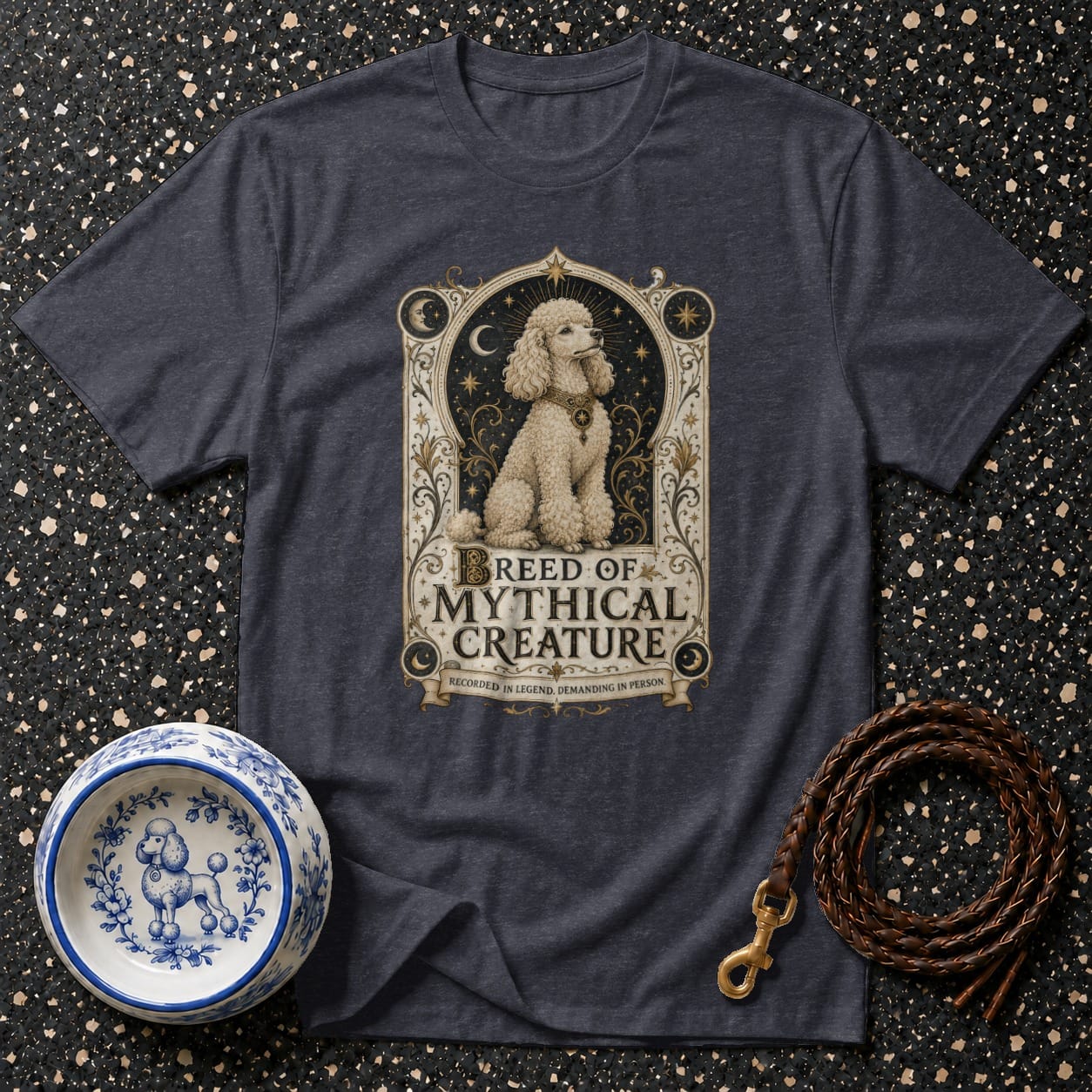 Dark gray t-shirt with a poodle in a framed "BREED OF MYTHICAL CREATURE" graphic.