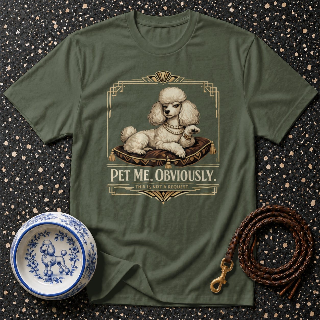 Green t-shirt with art deco design and text "Pet Me. Obviously."