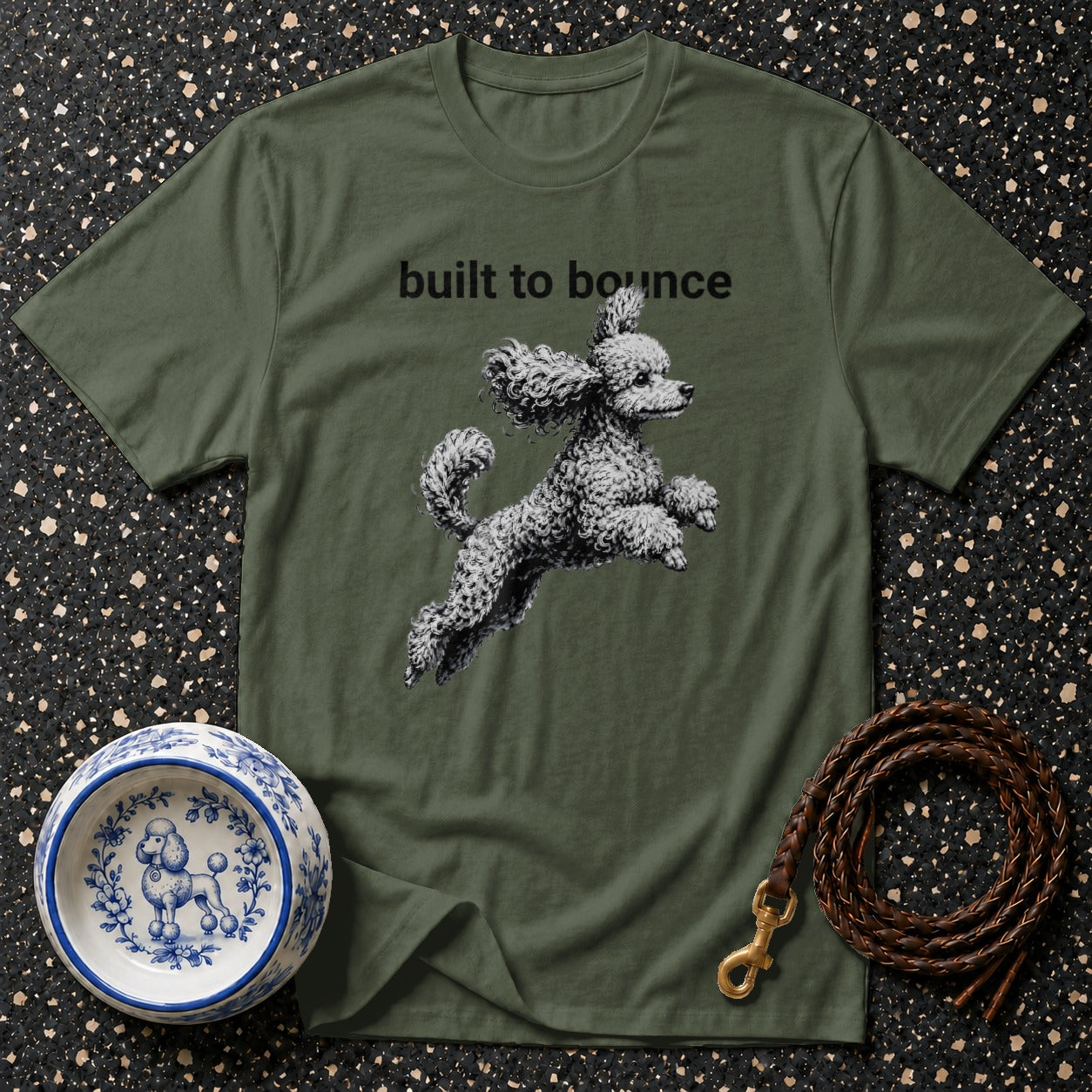 Green t-shirt with "built to bounce" and jumping poodle graphic.