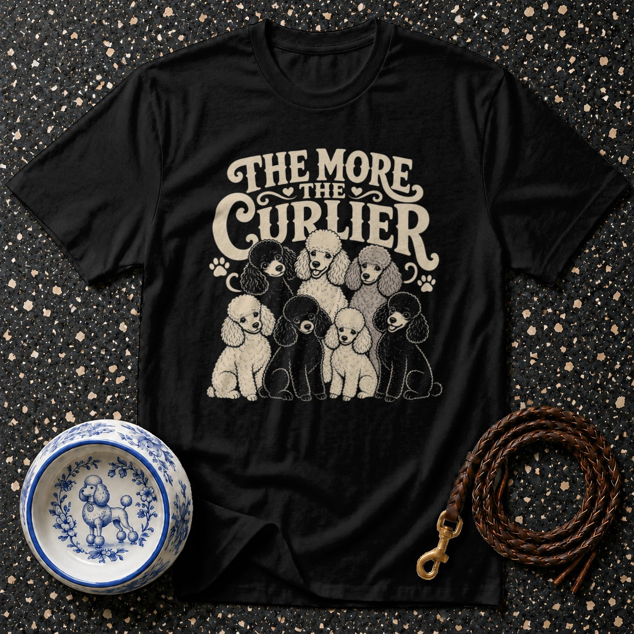 Black t-shirt with "The More The Curlier" text and a group of poodles.