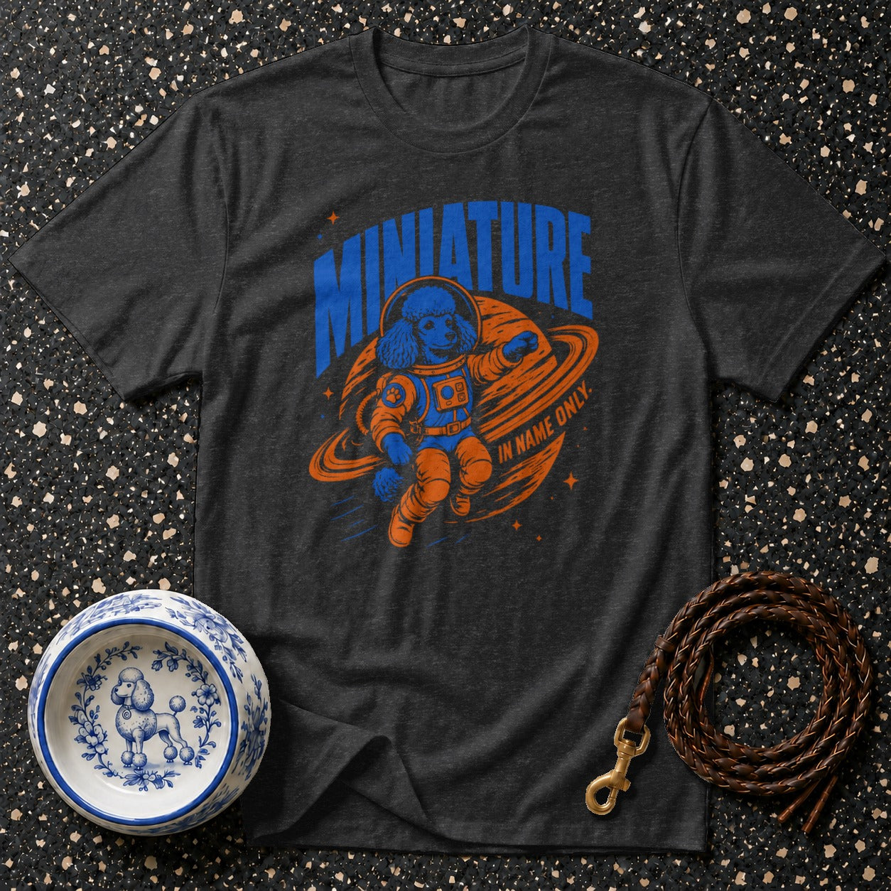 T-shirt with blue poodle astronaut on planet, "MINIATURE IN NAME ONLY".