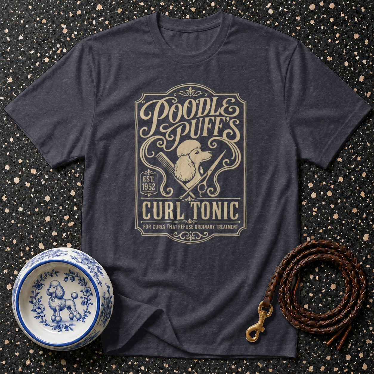 Dark gray t-shirt with "Poodle Puff's Curl Tonic" graphic and poodle illustrations.