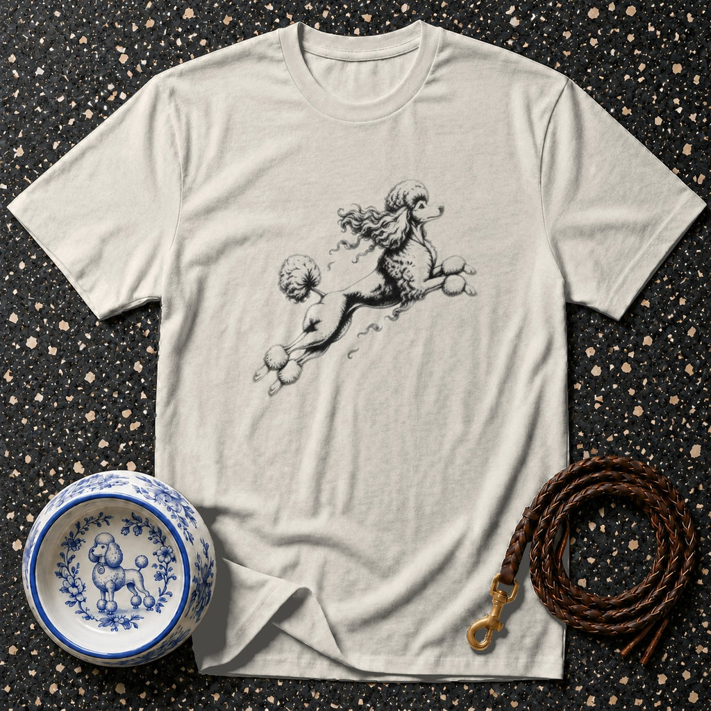 T-shirt with a black and white poodle illustration, dog bowl, and leather leash.