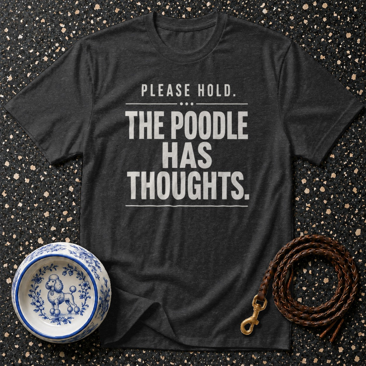 Dark gray t-shirt with text "PLEASE HOLD. THE POODLE HAS THOUGHTS."
