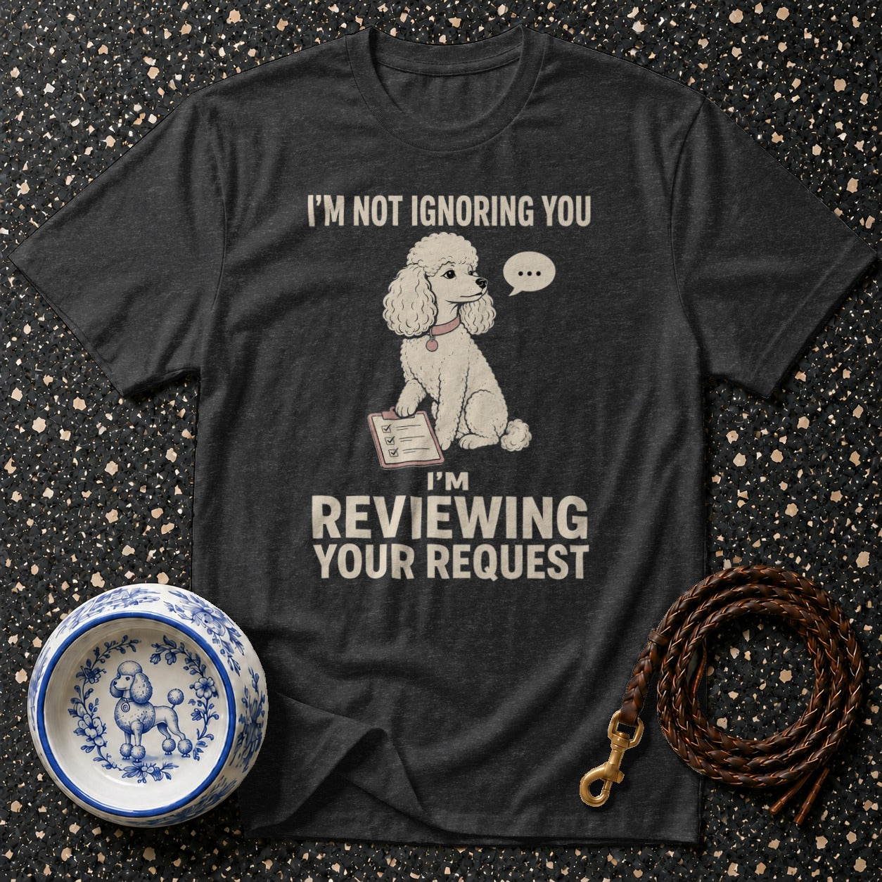 Dark grey t-shirt with a poodle graphic and text "I'M NOT IGNORING YOU I'M REVIEWING YOUR REQUEST".