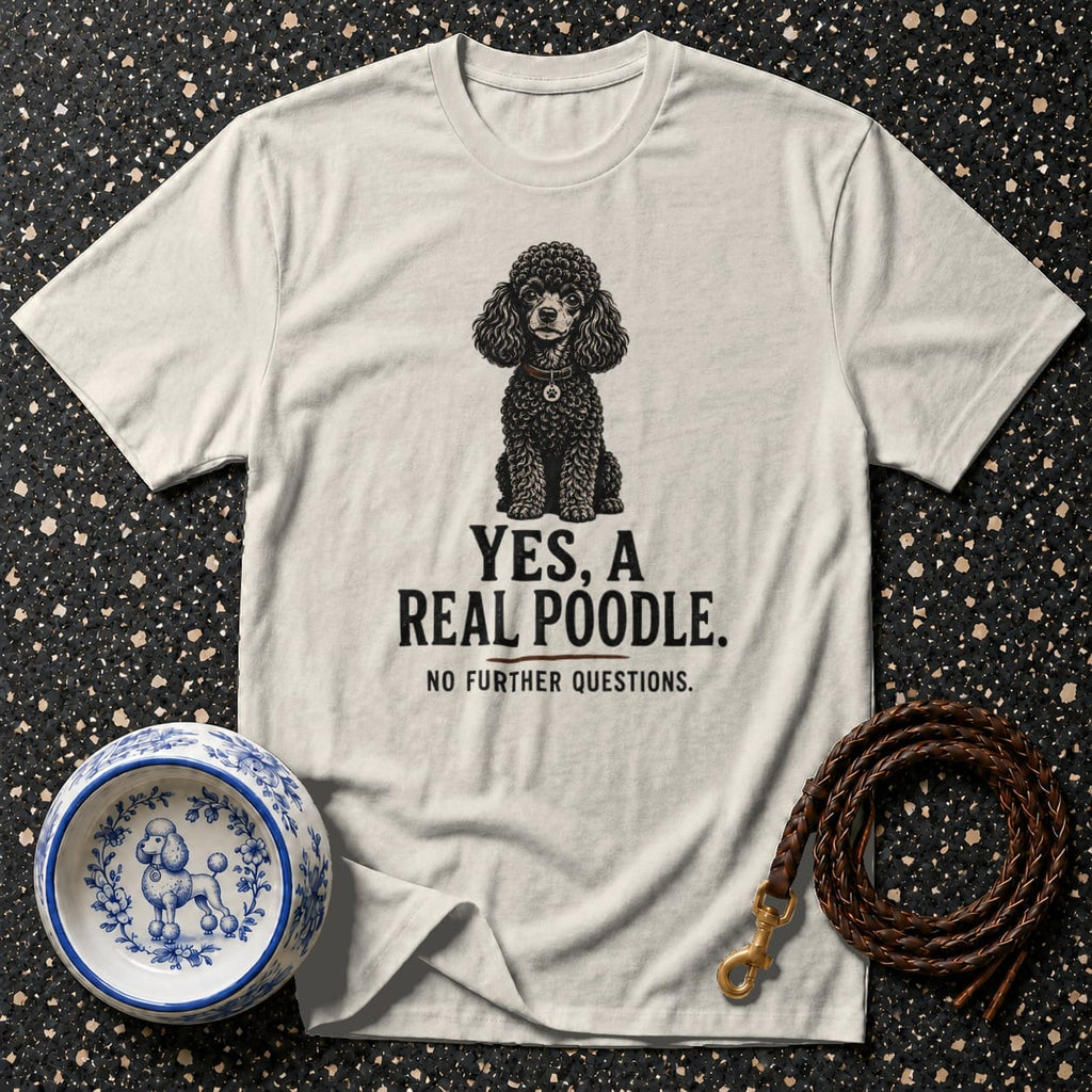 Cream t-shirt with black poodle graphic and text reading "YES, A REAL POODLE. NO FURTHER QUESTIONS."