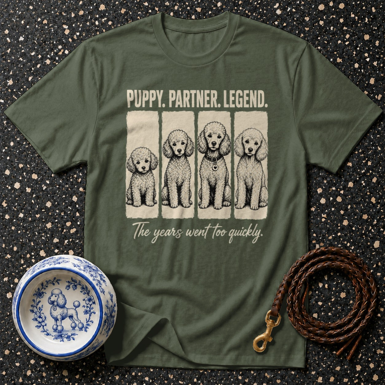 Green t-shirt with "PUPPY. PARTNER. LEGEND." and four poodles "The years went too quickly."