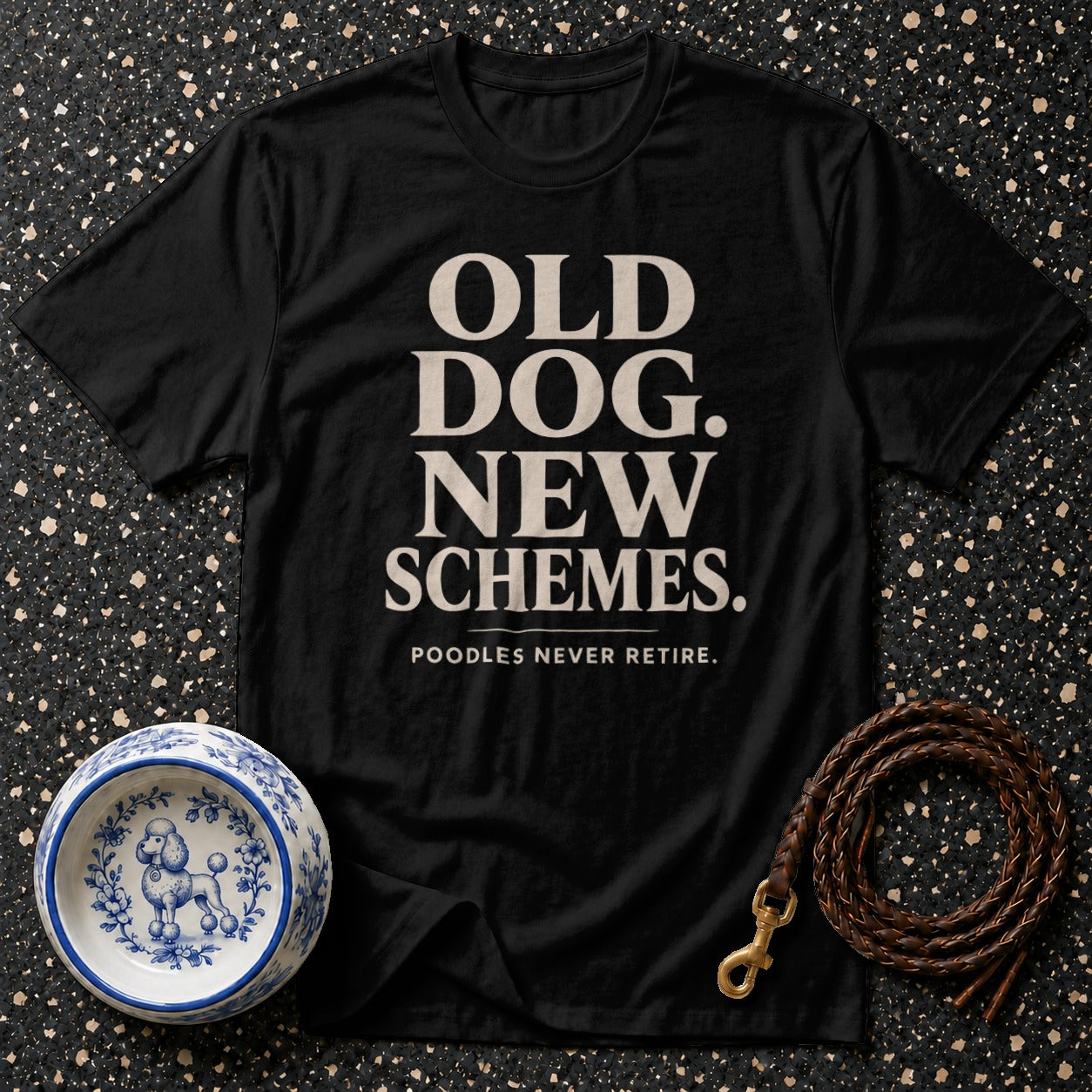 Black t-shirt with text "OLD DOG. NEW SCHEMES." and "POODLES NEVER RETIRE."