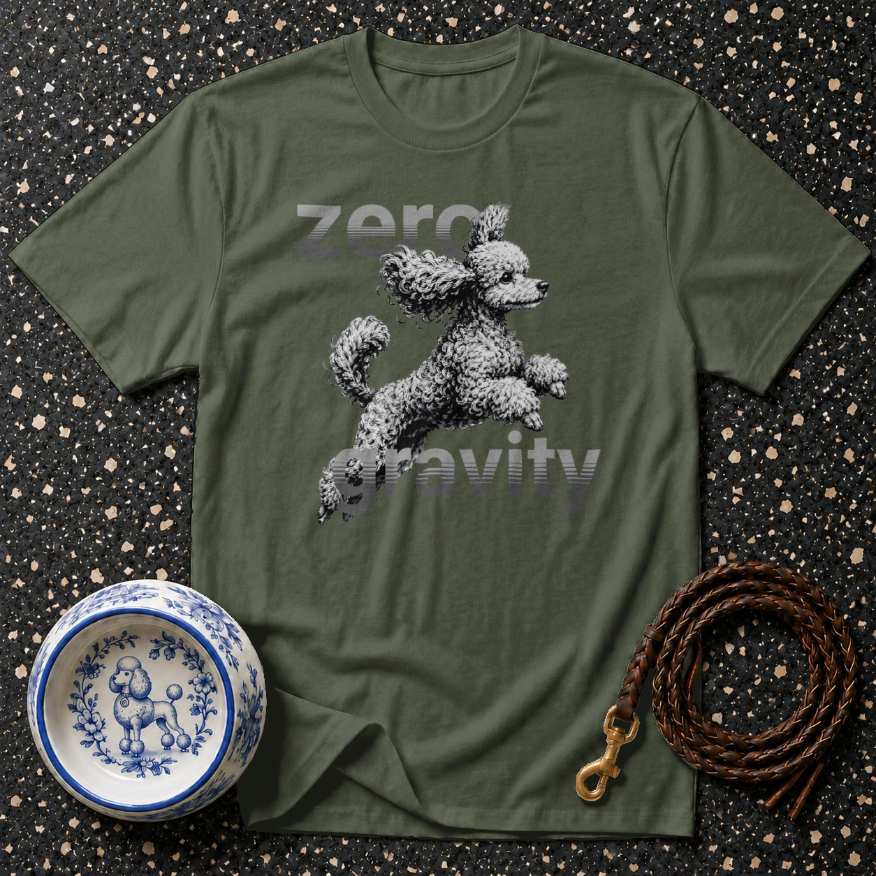 Green t-shirt with a poodle mid-leap and "zero gravity" text.