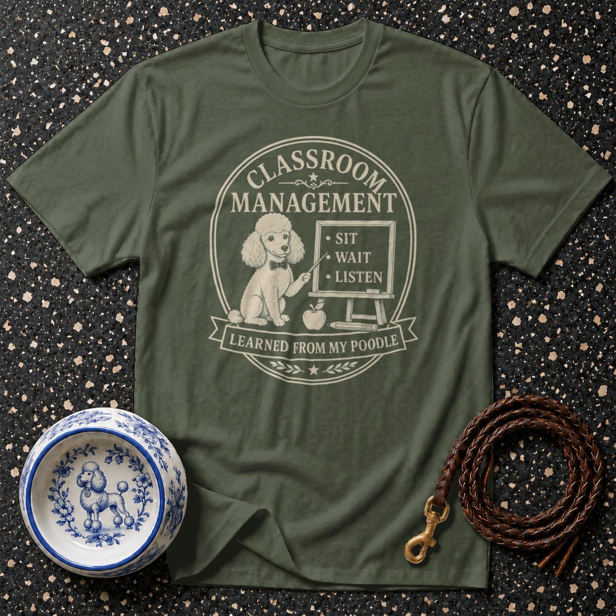 Olive t-shirt with poodle graphic and "Classroom Management Learned From My Poodle" text.