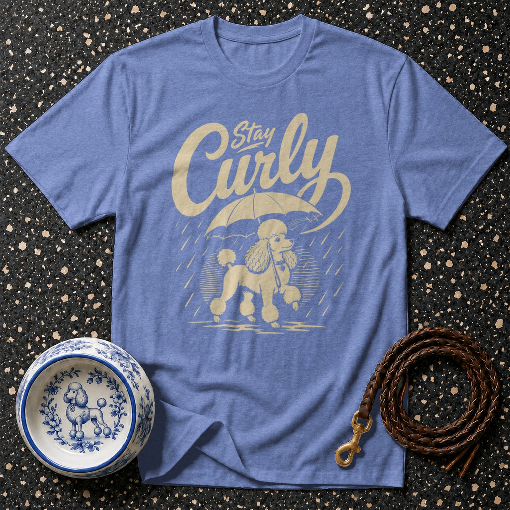 Blue t-shirt with "Stay Curly" text and poodle under umbrella graphic.