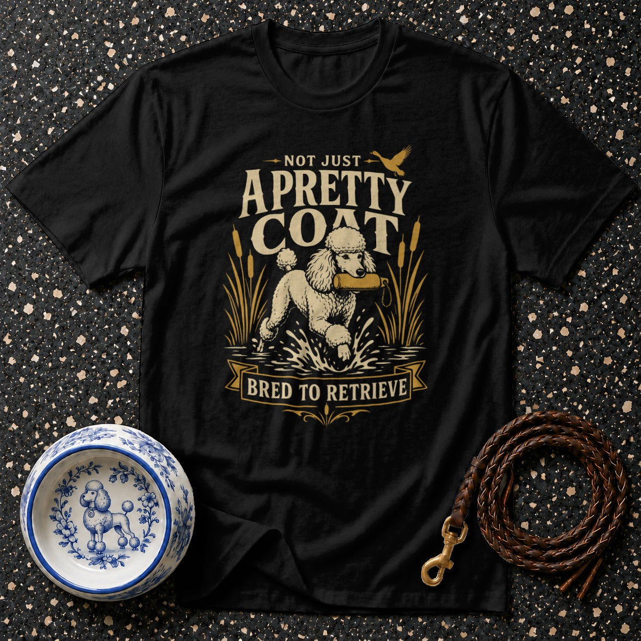 Black t-shirt with a poodle retrieving, text "Not Just A Pretty Coat, Bred to Retrieve".