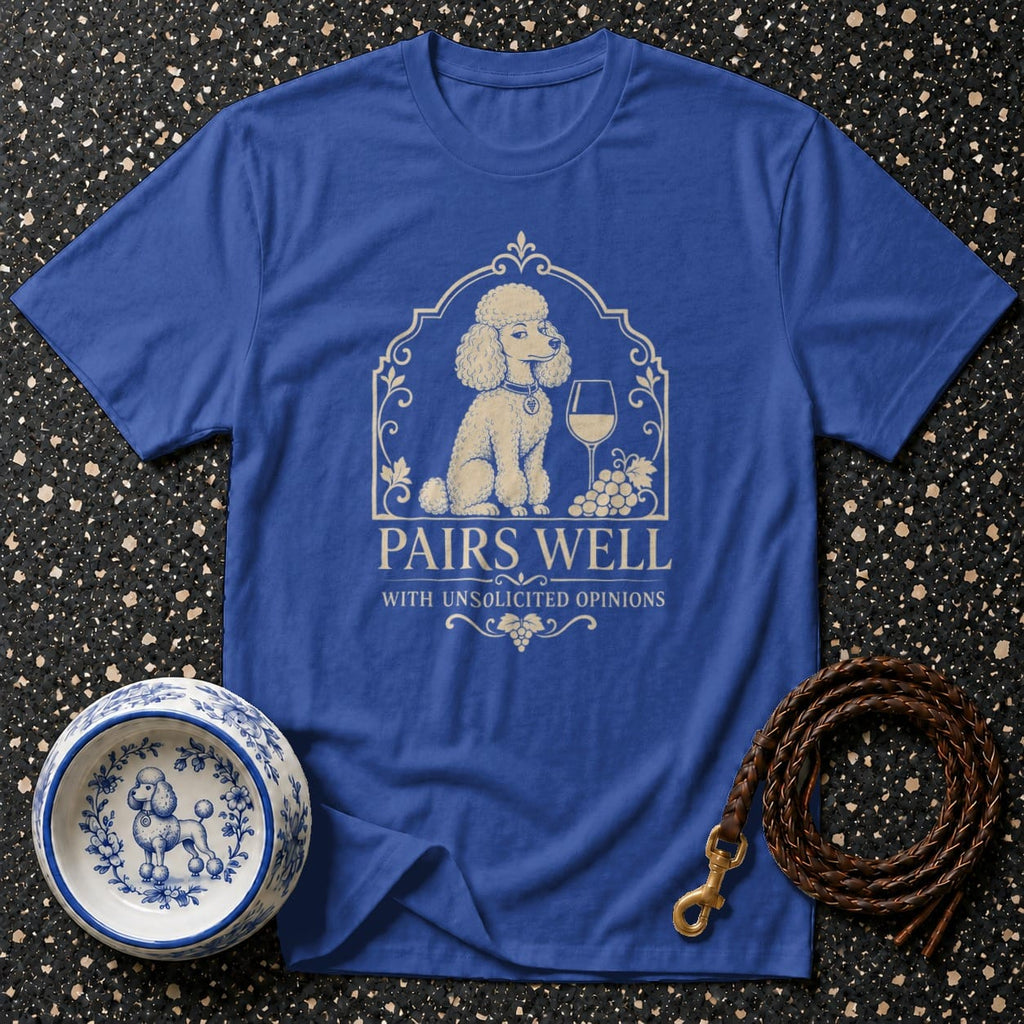 Blue t-shirt with a graphic of a poodle, wine glass, and grapes, reading "Pairs Well With Unsolicited Opinions".