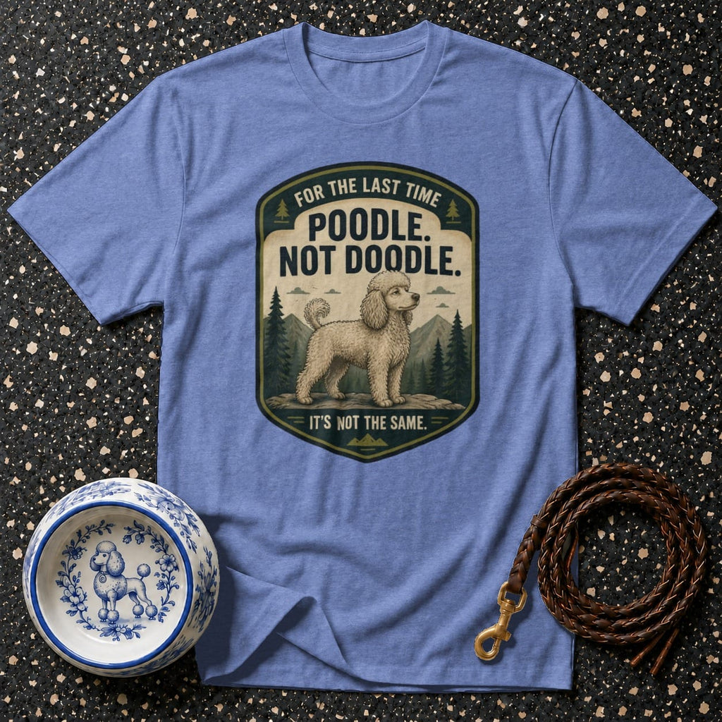 Blue t-shirt with "Poodle. Not Doodle. It's Not The Same." text and poodle illustration.