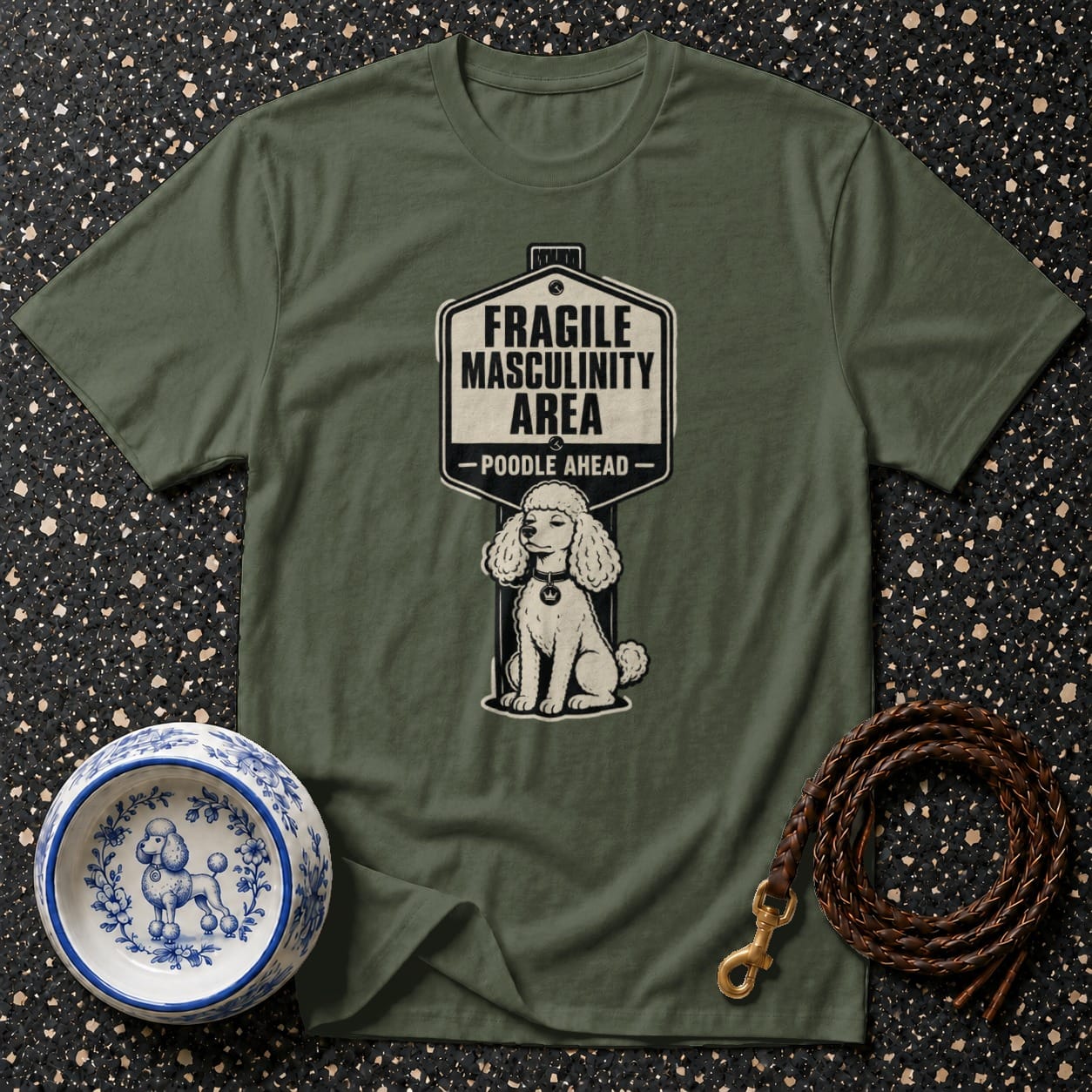 Olive t-shirt with "Fragile Masculinity Area - Poodle Ahead" sign and poodle illustration.