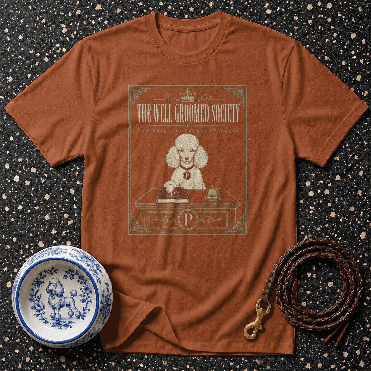 Brown t-shirt with "The Well-Groomed Society" graphic and a poodle.