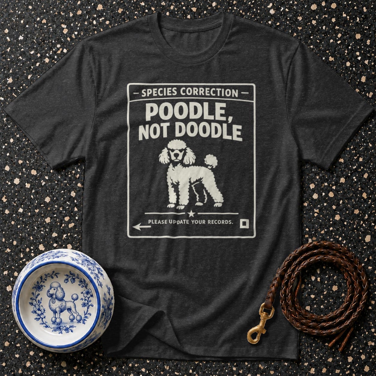 Dark t-shirt with white text: "SPECIES CORRECTION POODLE, NOT DOODLE" and a poodle drawing.