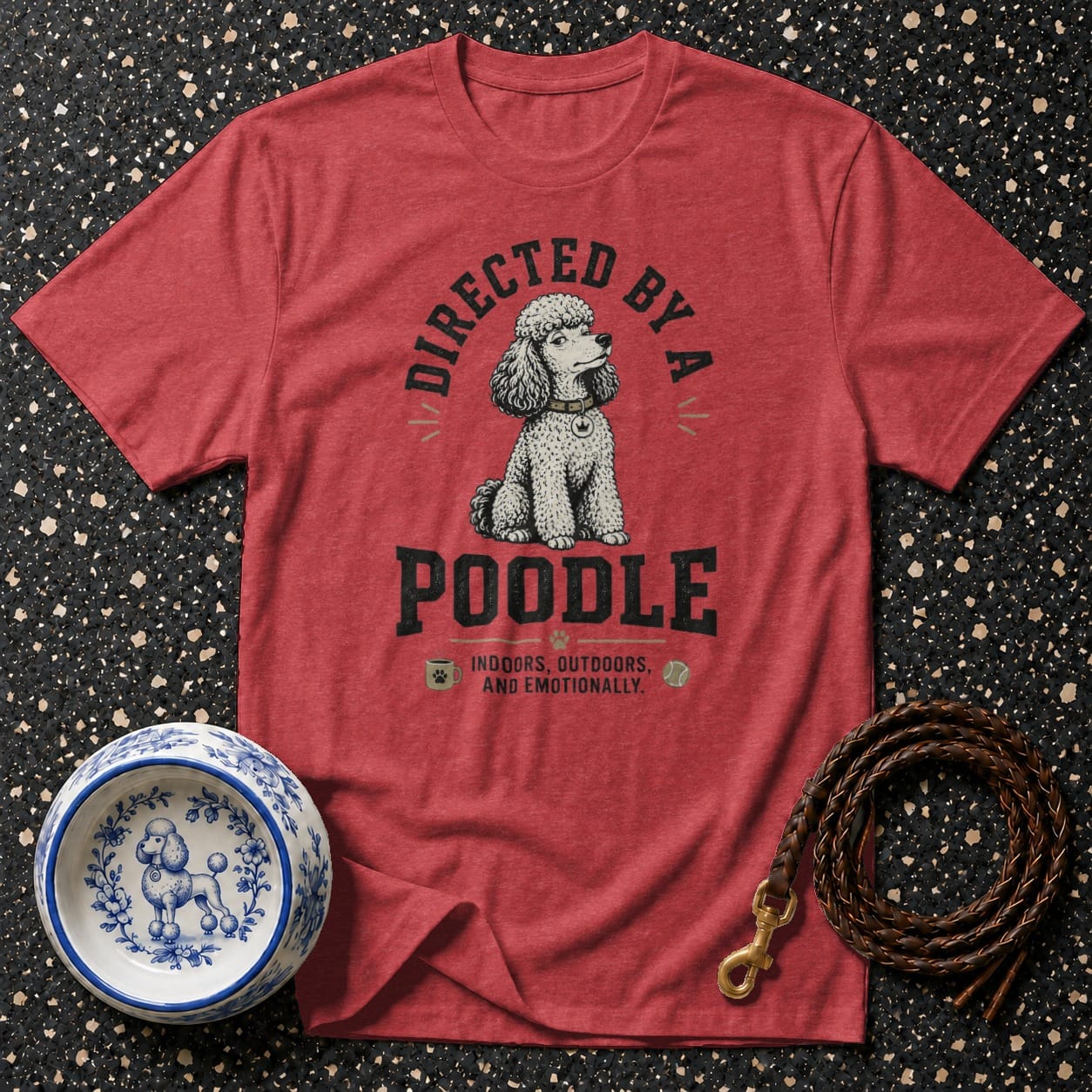 Red t-shirt with "Directed by a Poodle" text and poodle graphic.