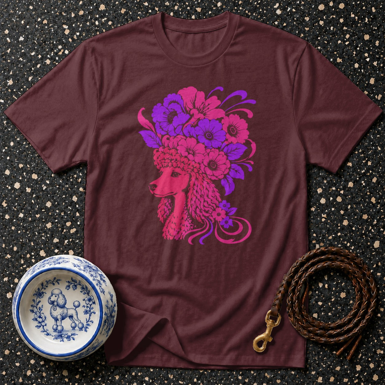 Maroon t-shirt with a pink and purple poodle and floral design.