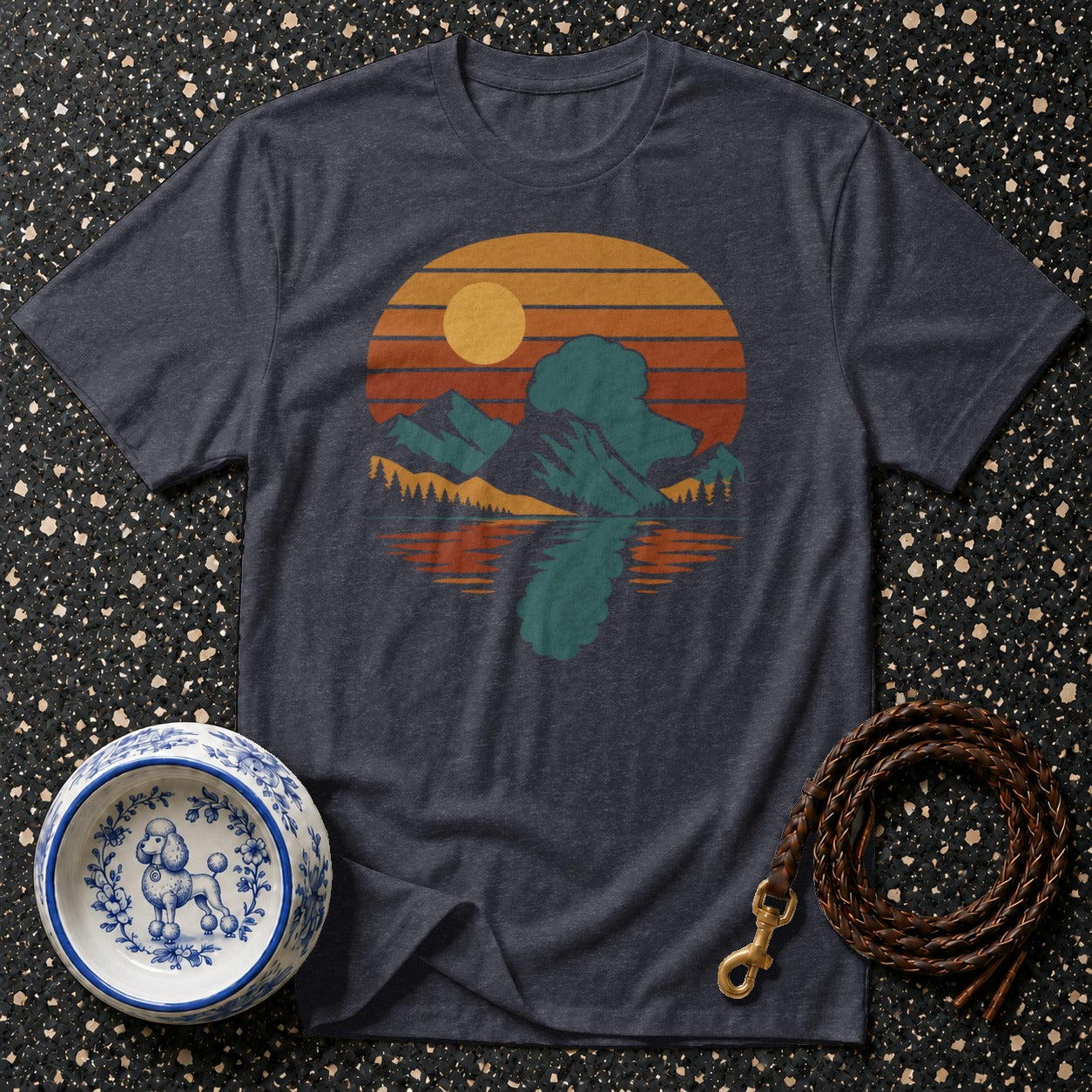 Dark grey t-shirt with a retro mountain sunset graphic and dog accessories.