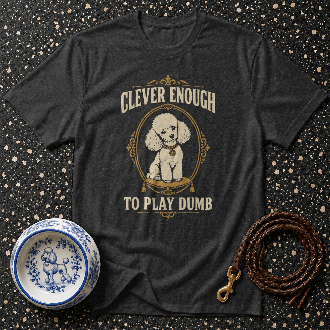 Dark t-shirt with a white poodle graphic and text "Clever Enough To Play Dumb".