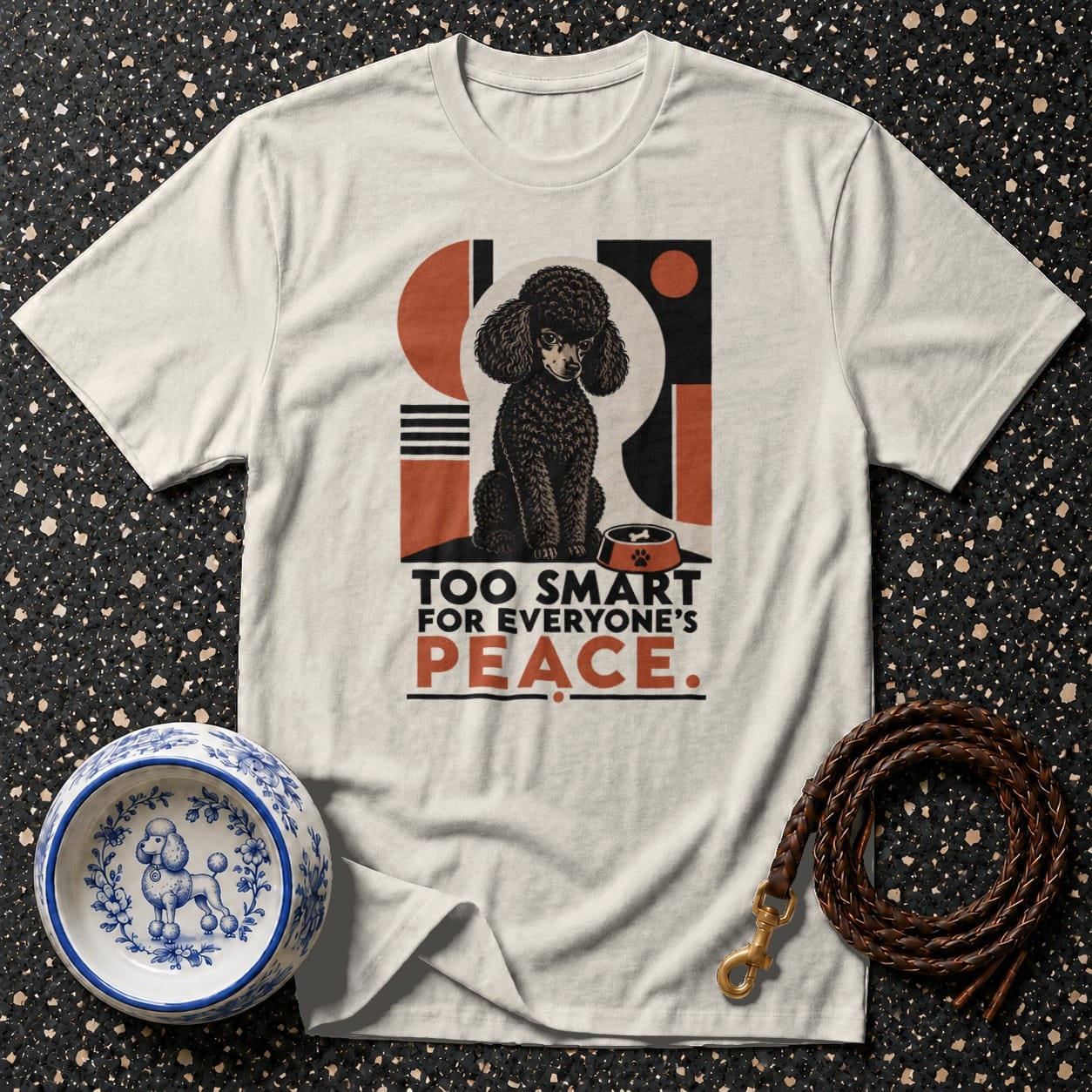 Cream t-shirt with graphic of black poodle, bowl, and text "TOO SMART FOR EVERYONE'S PEACE."