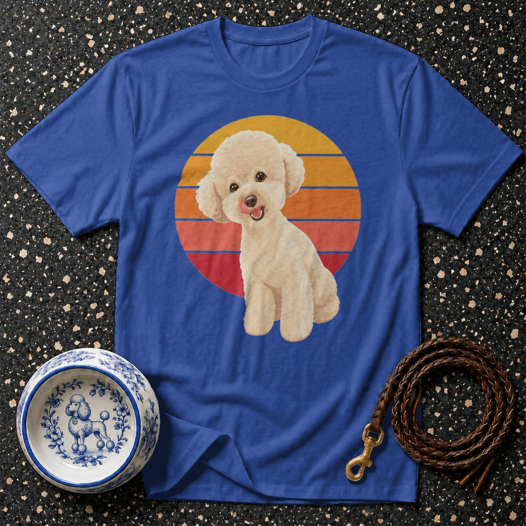 Blue t-shirt with cream poodle illustration against a retro sunset circle.