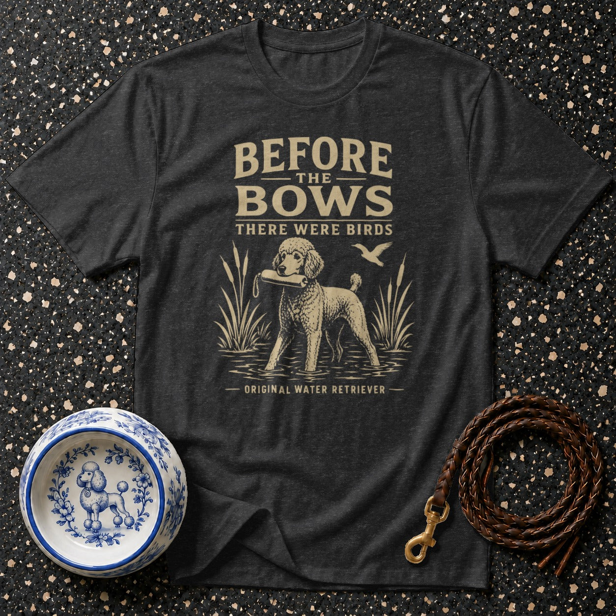 Dark grey t-shirt with "BEFORE THE BOWS THERE WERE BIRDS" and a poodle.
