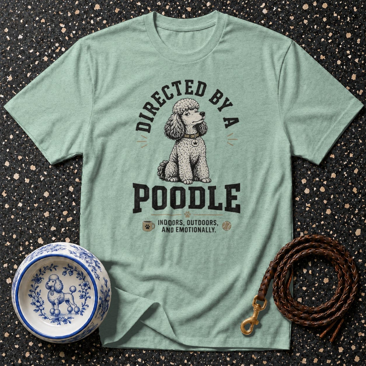 T-shirt with poodle illustration and text "Directed by a Poodle".