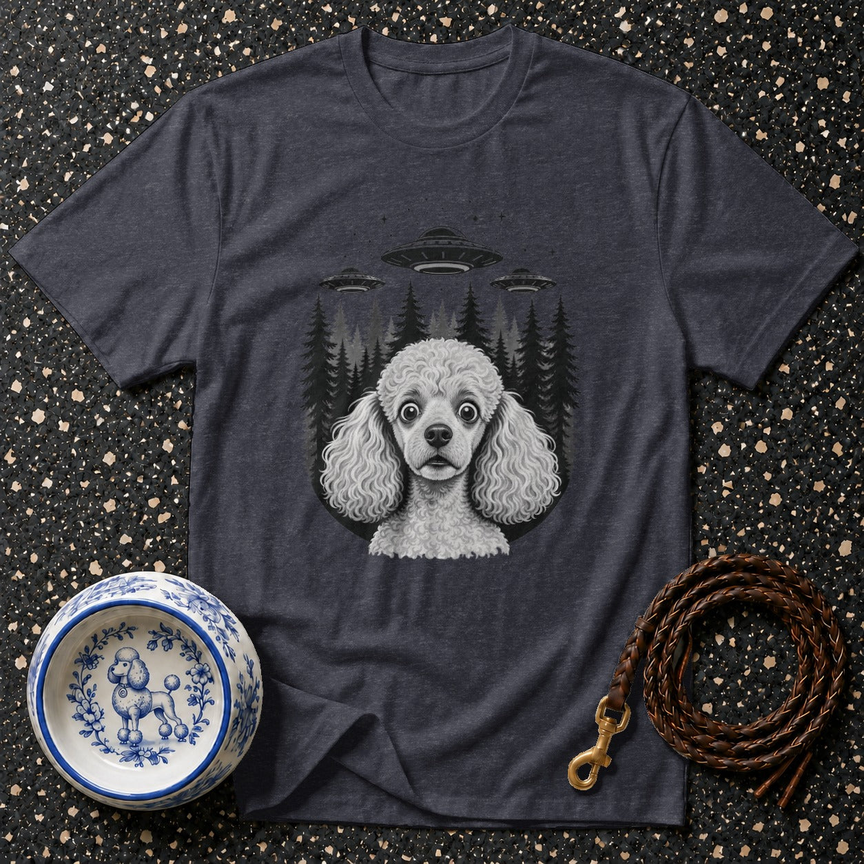 Graphic t-shirt with poodle and UFOs, plus a decorative dog bowl and leash.