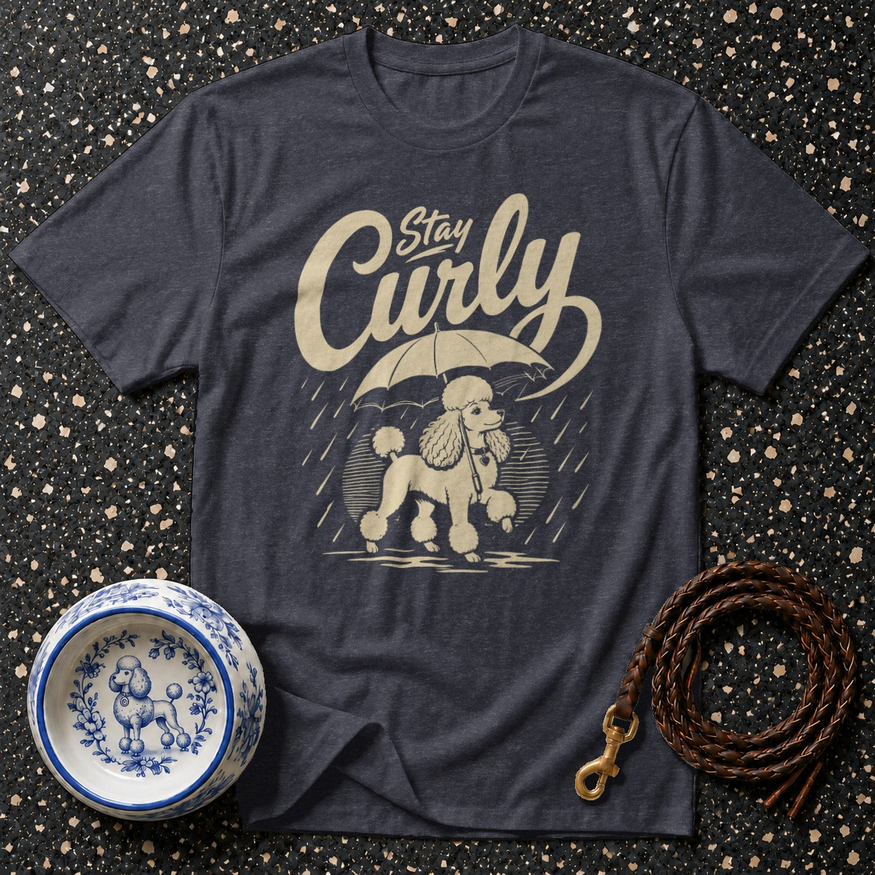 Dark grey t-shirt with a cream graphic of a poodle under an umbrella.