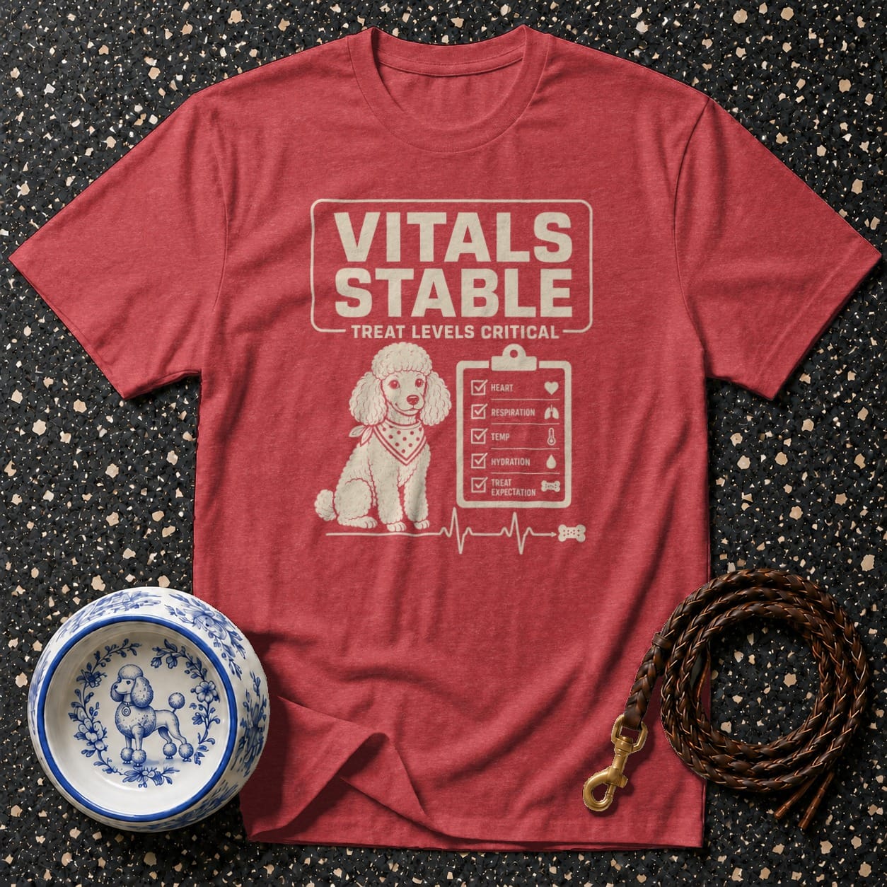 Red t-shirt with a poodle design and "Vitals Stable Treat Levels Critical" text.