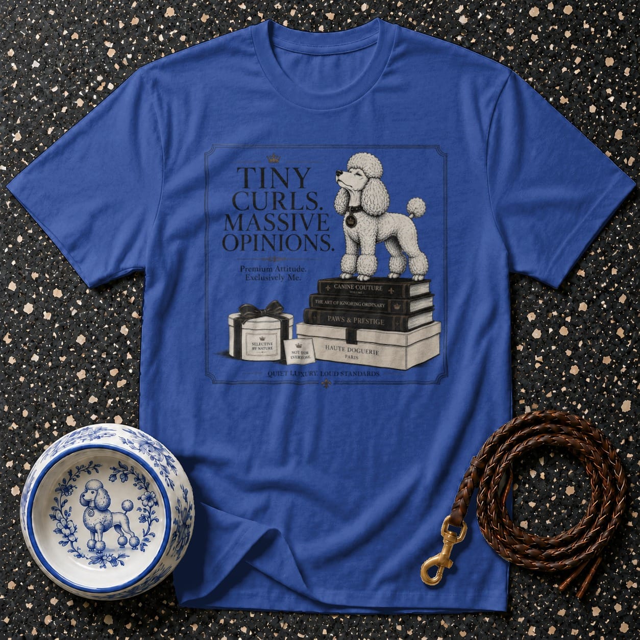 Blue t-shirt with a white poodle standing on books and text.