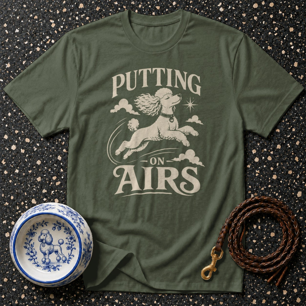 Olive t-shirt with poodle graphic and text "PUTTING ON AIRS".
