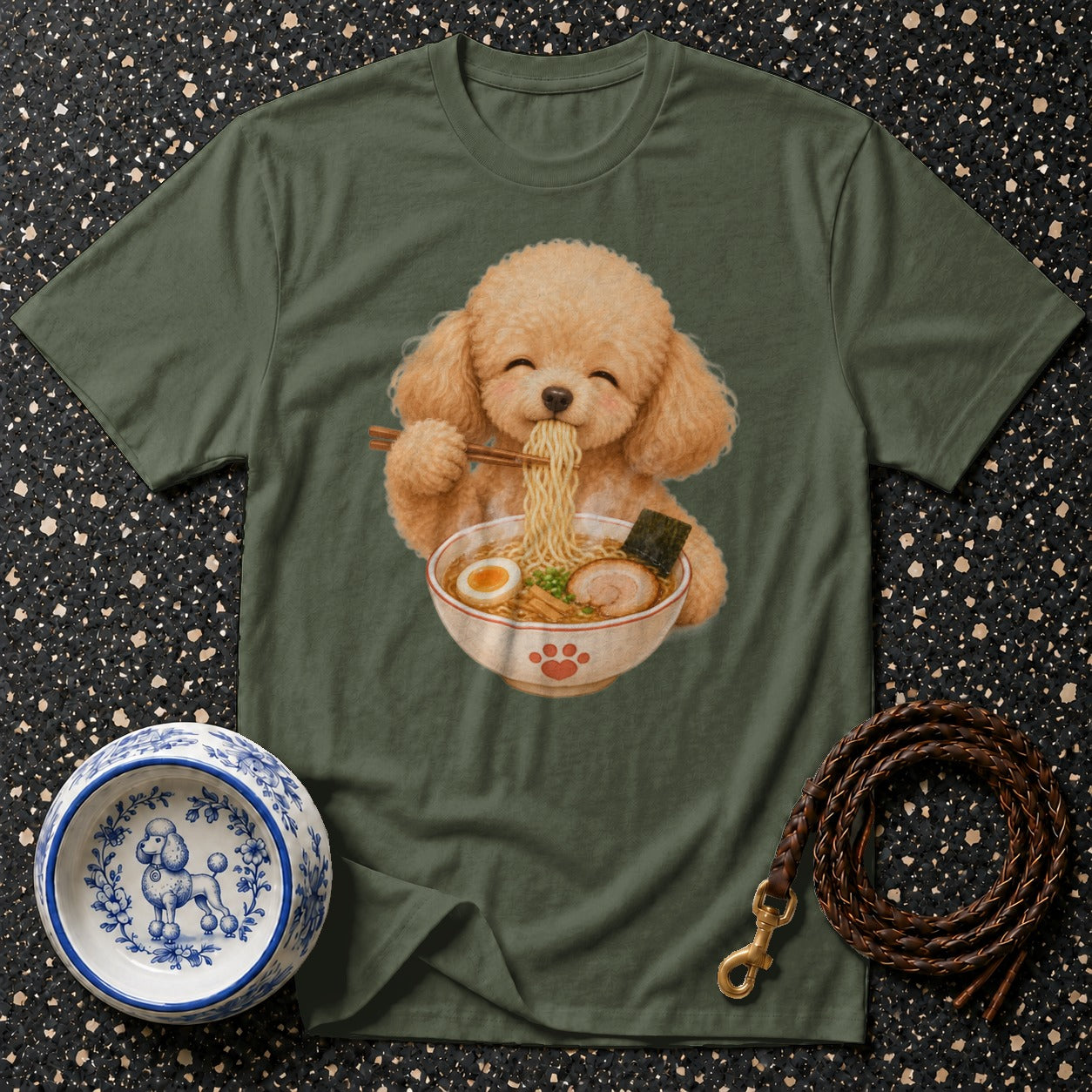 Fluffy dog wearing headphones eating ramen noodles on green t-shirt.