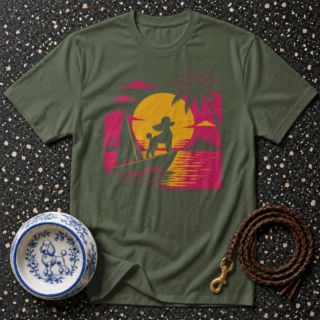 Green t-shirt with retro sunset sailboat graphic featuring a poodle.